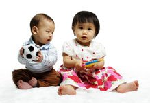 2 children sitting down